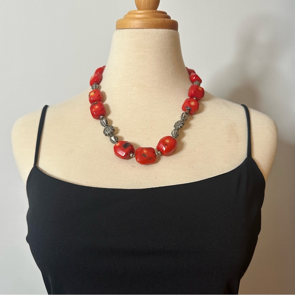 Chunky red and silver statement necklace.